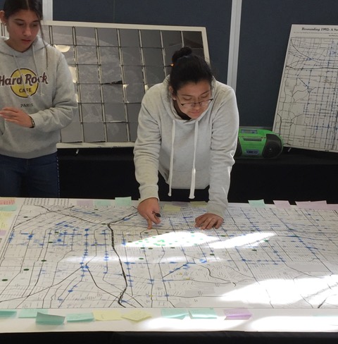 student with map of Los Angeles